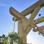 Close up view of the corner of a wooden pergola