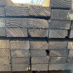 Stack of 3" x 1¼" wooden fence rails