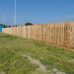 These green pressure treated softwood picket fence pales/slats are sold individually, shown here with 3 backing rails.