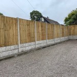 These vertical board panels make a solid fence panel, ideal for privacy.  Shown here with two concrete gravel boards