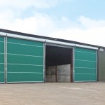 Four Galebreaker agridoors covering front of a shed