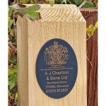 A J Charltons and Sons logo on a wooden gate