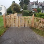 Chestnut Post and Rail Fencing shown with two gates covered with Chestnut fencing to match fence