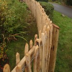 Chestnut Post and Rail Fencing shown here with chestnut fencing attached on both sides of railing