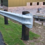 Crash barrier fish tail on end of a fence