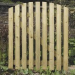 Charltons curved wicket gate which is lightweight and framed, ledged and braced with a planed finish in a garden setting