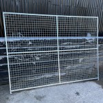 This dog pen side panel is roughly 6ft high by 8ft long.  Shown here placed against a shed
