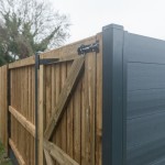 DuraPost gate/corner post shown with a gate attached and a composite fencing panel