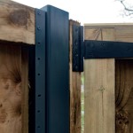 DuraPost gate post shown with a U channel attached and wooden fencing