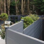 DuraPost composite fencing shown in Anthracite Grey with post caps