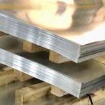 Galvanised flat sheets shown in a stack