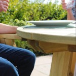 Close up view of the Zest Freya wooden round outdoor dining table