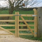 Wooden gate locking bar shown on gate