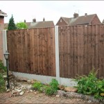 These smooth gravel boards are steel reinforced, shown here in a garden setting with panels on top of gravel boards.