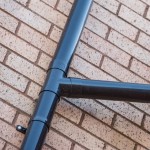 Single downpipe connector for deep style plastic guttering shown on a building