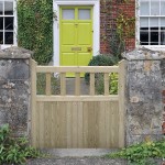 Charltons Hampton Wooden Gate with tongue and groove match boarding with vertical pales, Shown here in a garden setting