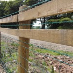 4" x 2" wooden rails shown on a fence
