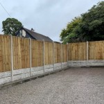 This Concrete fence post is designed to slot corner panel fencing into. This image shows a panel fence with concrete posts