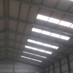 AS13/3 corrugated rooflights shown on the roof of a shed