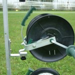 Wire reel holder shown on metal post