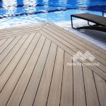 UltraShield composite wood decking shown beside a swimming pool