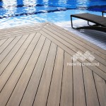 Warm Chestnut composite decking boards shown around a swimming pool