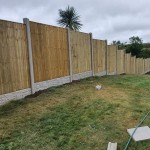 These vertical board panels make a solid fence panel, ideal for privacy.  Shown here between concrete posts