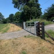 45" 6 bar metal field gate shown in a field