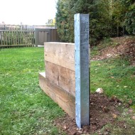 DuraPost Sleeper T Post shown with three garden sleepers attached