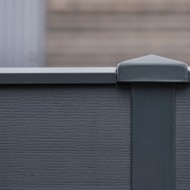 DuraPost capping rail shown on a composite fence