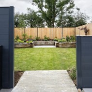 DuraPost gate/corner posts shown at the ends of two composite fences