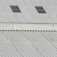 Black spat washers shown on a roof
