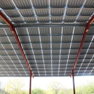 Briarwood Natural grey spaced fibre cement sheets shown on a roof