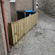 Rounded top pickets shown on a fence