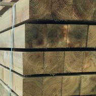 Square wooden fence stobs shown in a pile