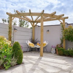 Forest Premium Radial Pergola shown in the corner of a garden