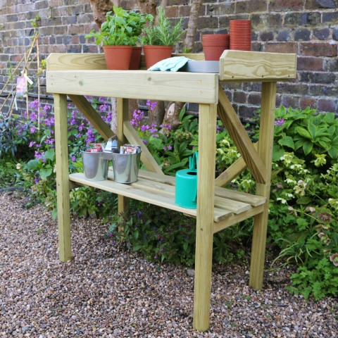 Zest garden potting bench shown in a garden setting
