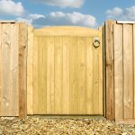 Charltons Wellow Wooden Gate with an arched top, rounded stiles and tongue & groove match boarding. Set between pickets.